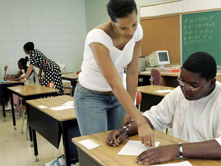 Developing effective ways to evaluate high school teachers holds the promise of improving the high school education experience for the millions of students who will be taught by these teachers. (AP/Mel Evans)