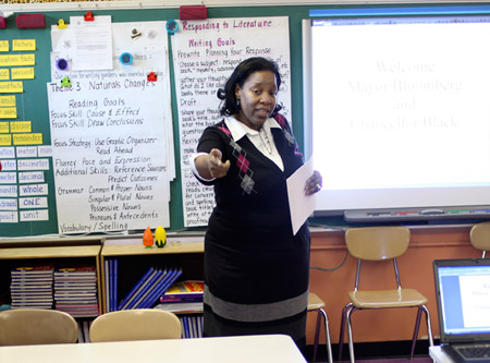 A teacher gestures in front of her class at P.S. 262 school in New York City. Research shows that students of color enjoy greater rates of academic success when they are taught by teachers of color, which makes it increasingly important for us to fix the teacher workforce’s low diversity as our demography evolves. (AP/Seth Wenig)