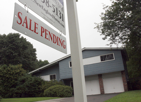 A sign announces a pending residential home sale in Wayland, Massachusetts, Wednesday, August 10, 2011. (AP/Bill Sikes)
