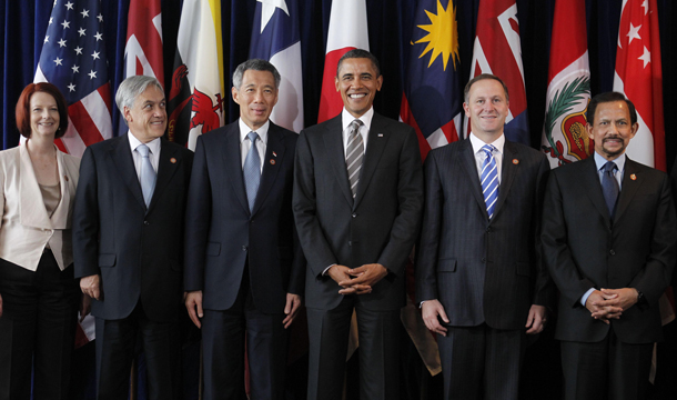 President Barack Obama, third right, stands with Prime Minister Julia Gillard of Australia, left, President Sebastian Pinera of Chile, second left, Prime Minister Lee Hsien Loong of Singapore, third left, Prime Minister John Key of New Zealand, second right, and Sultan Hassanal Bolkiah of Brunei, right, as they take part in the Trans-Pacific Partnership meeting at the APEC summit in Yokohama, Japan, Sunday, November 14, 2010. (AP/Charles Dharapak)