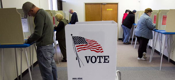 Early voters fill their ballots at the Douglas County Election Commision office in Omaha, Nebraska, on October 29, 2010. Conservatives are at work to prevent certain groups from voting in the upcoming presidential election. (AP/Nati Harnik)