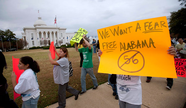 Protestors march outside the Alabama Capitol during a demonstration against Alabama's immigration law in Montgomery, Ala. (AP/Dave Martin)