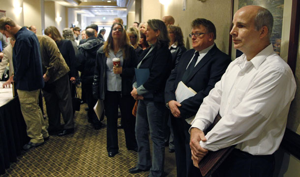 People wait in line to enter a job fair Friday, December 2, 2011, in, Portland, Oregon. The unemployment rate stood at 8.6 percent in November 2011, and the average length of unemployment reached a new record high of 40.9 weeks. (AP/Rick Bowmer)
