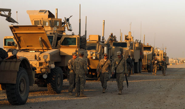 U.S. Army soldiers from 3rd Brigade, 1st Cavalry Division, based at Fort Hood, Texas, stage their armored vehicles at Camp Adder during final preparations for the last American convoy to leave Iraq on Saturday, December 17, 2011. (AP/Maya Alleruzzo)