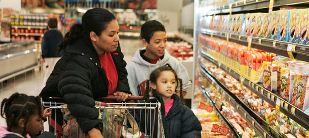 A family shops for groceries in Edmond, Oklahoma. Unemployed Americans are far more likely to spend their benefits on groceries, bills, and other goods and services than they are to sock it away for later. (AP)