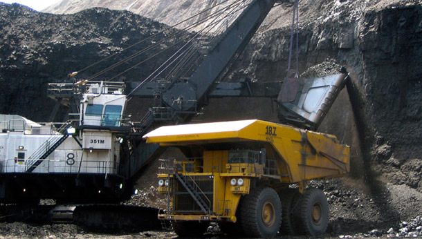A shovel prepares to dump a load of coal into a 320-ton truck at the  Black Thunder Mine in Wright, Wyoming, located within the state's Powder River Basin. The administration has recently handed out several leases to develop coal in the basin. (AP/Matthew Brown)
