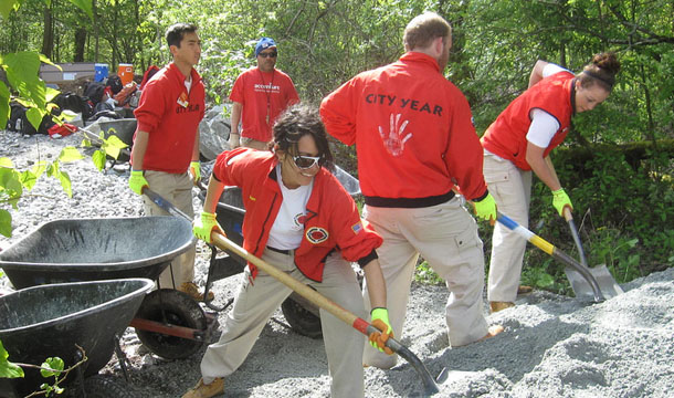 Members of AmeriCorps' City Year program work in Seattle, Washington, Friday, May 13, 2011. Extending national service programs to provide young people with full-time positions in AmeriCorps, VISTA, YouthBuild, and the youth service and conservation corps would create 60,000 new jobs. (Flickr/<a href=