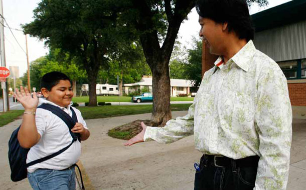 Community schools are uniquely equipped to develop their students into educated citizens who are ready and able to give back to their communities. (AP/ Tony Gutierez)