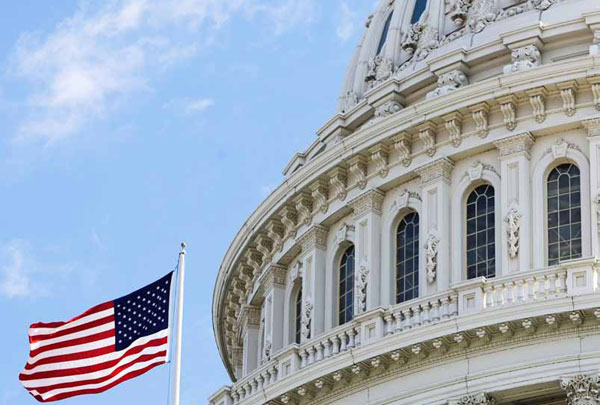 An American flag waves outside the U.S. Capitol Building in Washington, D.C. (AP/Manuel Balce Ceneta)
