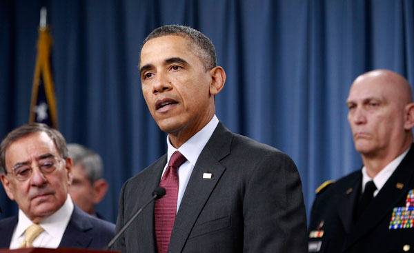 President Barack Obama, accompanied by Defense Secretary Leon Panetta, left, Army Chief of Staff Gen. Raymond T. Odierno, and other senior Defense Department and military officials, delivers speaks on the Defense Strategic Review, at the Pentagon on January 5, 2012. (AP/Haraz N. Ghanbari)