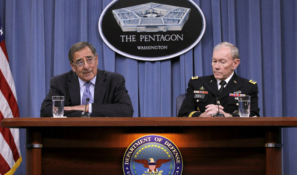 Secretary of Defense Leon Panetta, accompanied by Joint Chiefs Chairman Gen. Martin E. Dempsey, outlines the main areas of proposed spending cuts during a news conference at the Pentagon, Thursday, January, 26, 2012. (AP/Pablo Martinez Monsivais)
