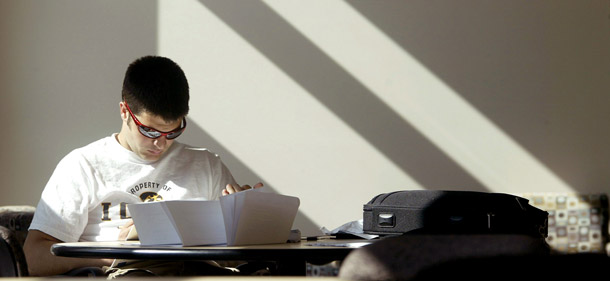 An unidentified University of Idaho student studies at the Teaching and Learning Center on campus in Moscow, Idaho. Policies to help bolser the middle class include rewarding students who work their way through college, awarding students college credit for proven knowledge, and connecting student loan repayments to postcollege pay levels for new graduates. (AP/Geoff Crimmins)