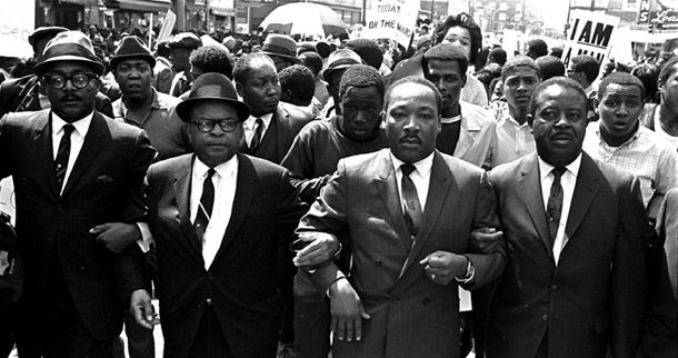 The Rev. Ralph Abernathy, right, and Bishop Julian Smith, left, flank  Dr. Martin Luther King, Jr., during a civil rights march in Memphis,  Tennessee on March 28, 1968. No one knows what King would do if he were alive today, but we can try to answer that question by looking back at what he did during his lifetime. (AP/Jack Thornell)