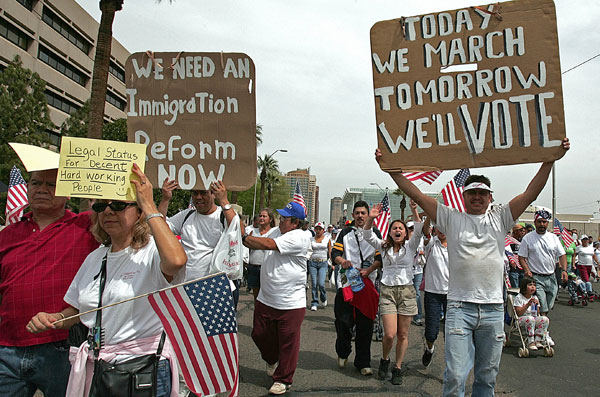 Immigration-rights demonstrators march to the Arizona state Capitol in April 2006. These immigration protests sent hundreds of thousands of people into the streets this spring and promised to leave behind a surge of new Hispanic voters.
<br /> (AP/Matt York)