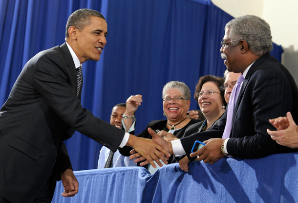 President Barack Obama greets the audience as he arrives at Northern Virginia Community College to highlight his 2013 budget, which contains plenty for communities of color to cheer about. (AP/ Susan Walsh)