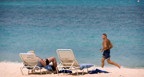 Besides its beautiful beaches, the Cayman Islands are one of a handful of small countries with little or no corporate taxes in which many U.S. multinationals report their largest profits. (AP/ Brennan Linsley)