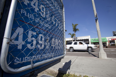 A sign displays gas prices at a gas station Friday, February 17, 2012, in San Diego, California. (AP/Gregory Bull)