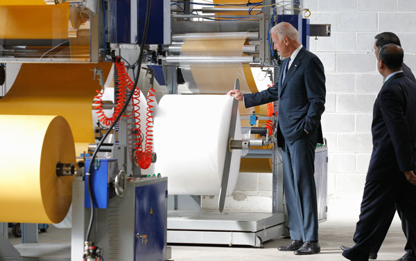 Vice President Joe Biden tours Wrap-Tite, Inc., a stretch-wrap manufacturing company which landed a $1.5 million Small Business Administration loan in 2011. With Biden are Wrap-Tite, Inc. CEO Suresh Bafna, rear, and President Sunil Daga.
<br /> (AP/Amy Sancetta)