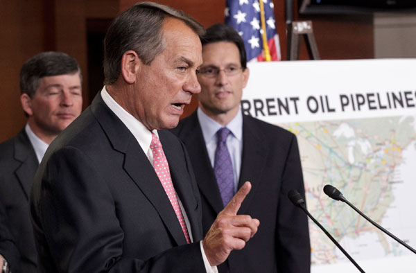 House Speaker John Boehner (R-OH), center, accompanied by House Majority Leader Eric Cantor (R-VA), right, and Rep. Jeb Hensarling (R-TX), gestures during a news conference to discuss President Barack Obama's decision to halt the Keystone XL pipeline. (AP/J. Scott Applewhite)