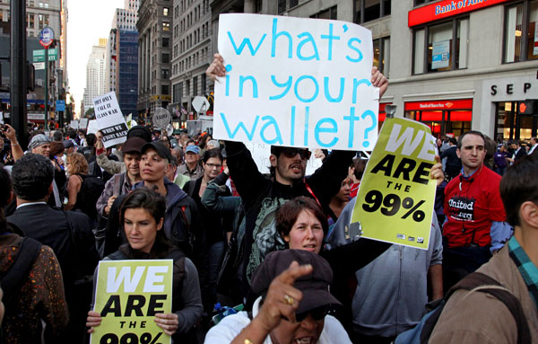 Occupy Wall Street protestors march in New York City near Zuccotti Park in October 2011. Occupy Wall Street began as a movement to expose the growing class stratification in America. (AP/Craig Ruttle)