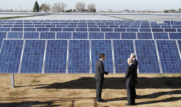 Recurrent Energy Chief Executive Officer Arno Harris, left, talks with Gov. Jerry Brown (D-CA), center, and Interior Secretary Ken Salazar, right, while touring the Recurrent Energy solar project in Elk Grove, California, Friday, January 13, 2012. (AP/Rich Pedroncelli)