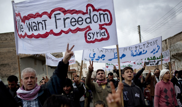 Villagers chant antigovernment slogans during a demonstration organized after a man killed during clashes between the Free Syrian Army and Syrian leader Bashar al-Assad's forces in Sarmin, Syria, Tuesday, February 28, 2012. (AP/Rodrigo Abd)