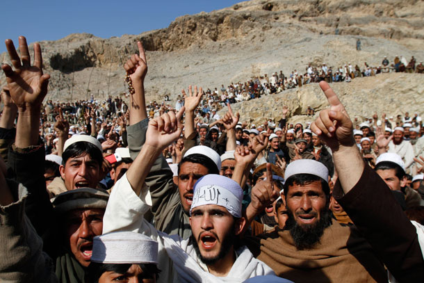 Afghans shout slogans during an anti-United States protest over burning of Korans at a military base in Afghanistan. (AP/ Rahmat Gul)