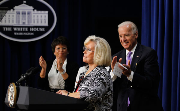 Lilly Ledbetter is applauded by Vice President Joe Biden and Senior White House Advisor Valerie Jarrett at an event on solutions for families balancing the dual demands of work and caring for family in July 2010. Women have made positive strides in the federal workforce, but much still needs to be done to diversify government employment opportunities.
<br /> (AP/Charles Dharapak)