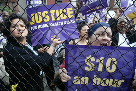 Home health aides demonstrate during a rally sponsored by 1199 SEIU, Service Employees International Union, on the first day of a three-day strike to demand fair pay and health benefits for home health aides, Monday, June 7, 2004, in New York. (AP/Mary Altaffer)