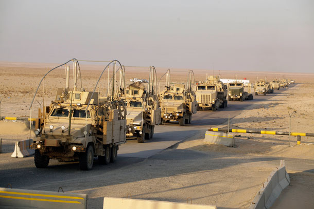 The last vehicles in a convoy of the U.S. Army's 3rd Brigade, 1st Cavalry Division crosses the border from Iraq into Kuwait on December 18, 2011. The brigade's special troops battalion are the last American soldiers to leave Iraq. (AP/ Maya Alleruzzo)