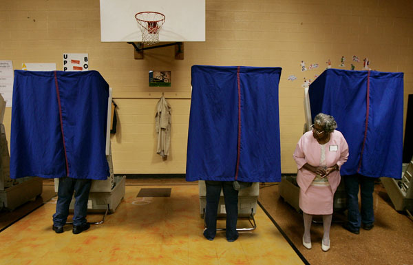 Poll volunteer Ethel Dunson waits for voters to finish in Columbus, Ohio, in November 2004. Even though Ohio's white population has decreased since 2000, its Hispanic and African American populations have increased.
<br /> (AP/Laura Rauch)