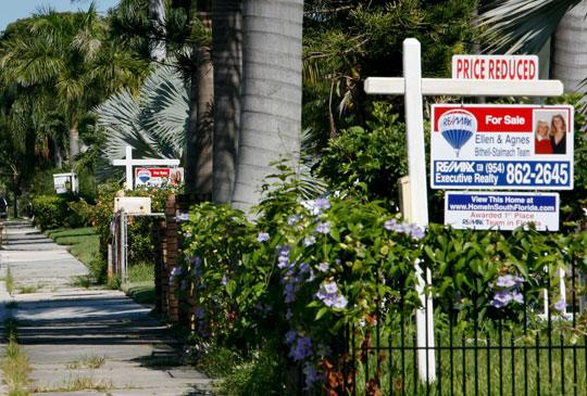 "For sale" signs line the front yards of several houses in a Hollywood, Florida, neighborhood in 2008. The Ryan budget plan for fiscal year 2013 would be devastating for the housing market across the country.
  (AP/Marianne Armshaw)