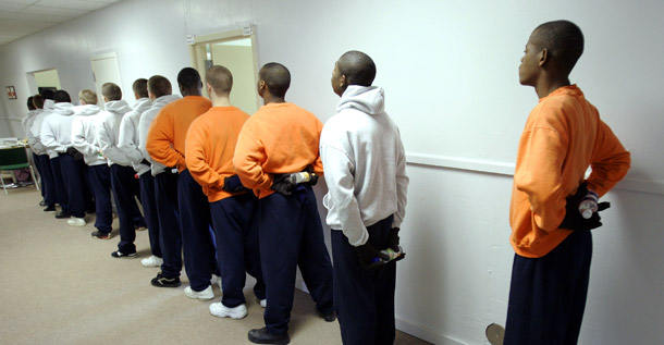 Inmates at the Department of Youth Services juvenile boot camp wait to go outside for physical training in Prattville, Alabama. Social Impact Bonds have enormous potential in areas of social policy such as homelessness, juvenile delinquency, preventive health care, and workforce development. (AP/Rob Carr)