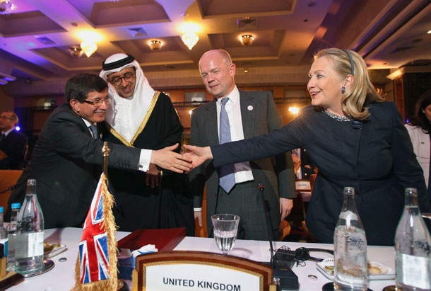 U.S. Secretary of State Hillary Rodham Clinton, right, meets with Turkey's Foreign Minister Ahmet Davutoglu, left, United Arab Emirates' Foreign Minister Sheikh Abdullah bin Zayed al-Nahyan second left, and British Foreign Minister William Hague at the Friends of Syria Conference in Tunis. (AP/ Jason Reed)