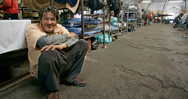 A Vietnam-era veteran leans against a bunk at a homeless shelter for veterans in San Diego. Nearly 1 in 7 homeless adults are veterans as of December 2011. (AP/Lenny Ignelzi)