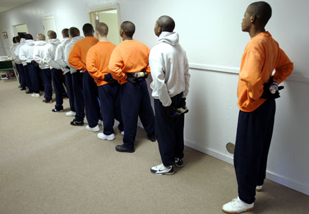 Inmates at the Department of Youth Services juvenile boot camp wait to go outside for physical training in Prattville, Alabama. (AP/Rob Carr)
