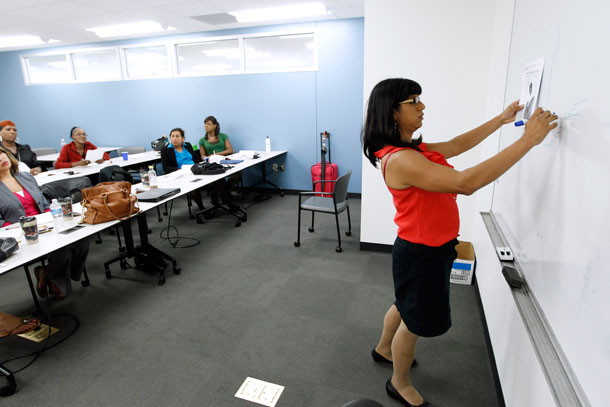 Laya Monarez writes on the board during the Project Empowerment workshop  at Department of Employment Services in Washington. Washington’s program is one of several transgender-oriented career  development classes, workshops, or job fairs that have popped up around  the country. (AP/ Jose Luis Magana)