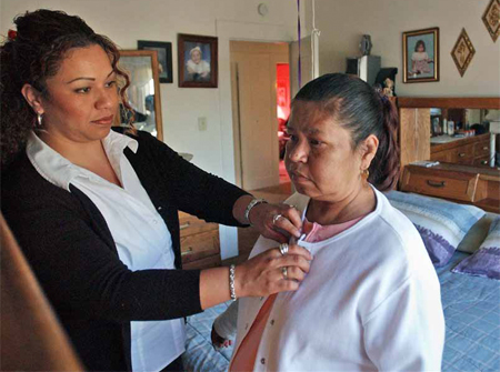 Women are more likely than men to leave a job or make the shift from full-time to part-time work in order to provide ongoing care to an elderly, ailing parent. (AP/Ben Margot)