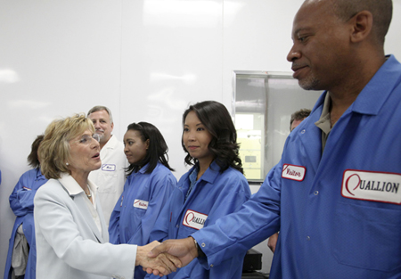 Sen. Barbara Boxer (D-CA), left, greets employees during her visit to a lithium-ion battery maker to talk about creating green jobs and producing clean energy, Tuesday, July 6, 2010, in Los Angeles. (AP/Nick Ut)