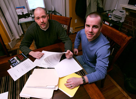 Bob Murch, left, and Gary Halteman, a gay couple, go over their tax information in their Salem, Massachusetts home, (AP/ Charles Krupa)