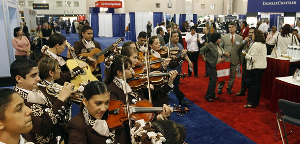 The Los Changuitos Feos mariachi band performs for convention goers at the U.S. Hispanic Chamber of Commerce's annual Convention and Business Expo at the Pennsylvania Convention Center in Philadelphia. Latino  entrepreneurs and consumers are helping Pennsylvania’s economy grow. (AP/Matt Rourke)