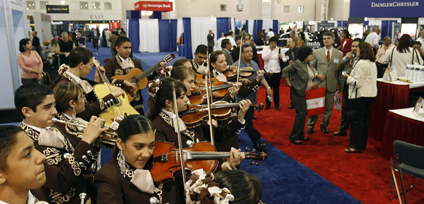 The Los Changuitos Feos mariachi band performs for convention goers at the U.S. Hispanic Chamber of Commerce's annual Convention and Business Expo at the Pennsylvania Convention Center in Philadelphia. Latino entrepreneurs and consumers are helping Pennsylvania’s economy grow. (AP/Matt Rourke)
