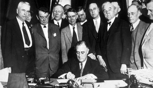 President Franklin D. Roosevelt is shown signing a law that created the Tennessee Valley Authority in 1933. President Roosevelt's so-called New Deal liberalism drew largely from ideas of classic liberalism.
<br /> (AP Photo)