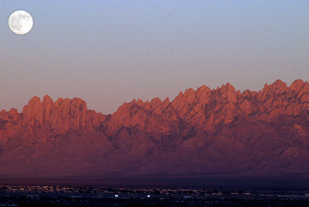 As dusk settles upon Las Cruces, New Mexico, a full moon emerges from behind the Organ Mountains. Protecting the Organ Mountains-Desert Peaks would be a significant homage to the people and history of New Mexico during the state’s centennial anniversary this year. (AP/AP Photo/Las Cruces Sun-News, Shari Vialpando)