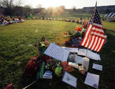 The sun rises over a makeshift memorial on the campus of Virginia Tech in Blacksburg, Virginia, Monday, April 23, 2007. (AP/Mary Altaffer)