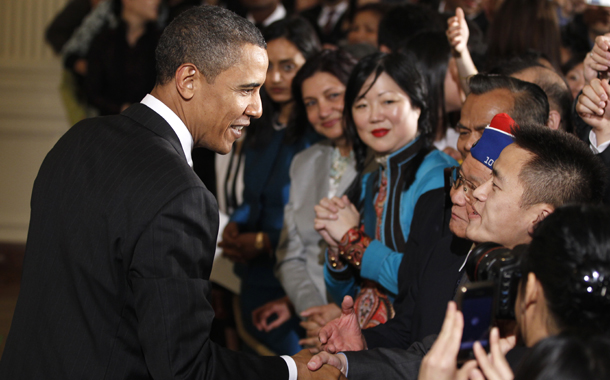 President Barack Obama greets audience members as he hosts a reception to celebrate Asian American and Pacific Islander Heritage Month in the East Room of the White House in Washington, Monday, May 24, 2010. (AP/Charles Dharapak)