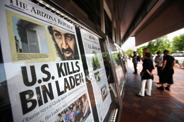 People look at a display of newspaper front pages at the Newseum in Washington, D.C. on May 2, 2011, the day after Osama bin Laden was killed. (AP/ Jacquelyn Martin)