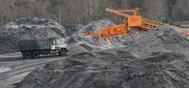 Trucks carry out loads of coal at the Pine Creek Coal Company in Spring Glen, Pennsylvania. A new EPA standard aims to limit carbon pollution from new power plants, including coal-fired plants. (AP/Rick Smith)