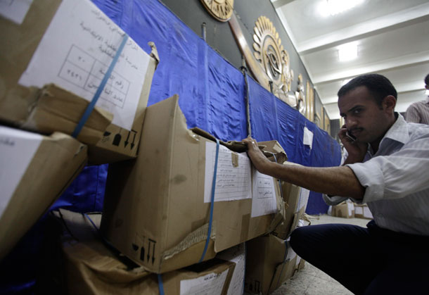 An Egyptian election official counts boxes containing ballots for the presidential election at a court in Cairo, Egypt on May 22, 2012. (AP/ Amr Nabil)