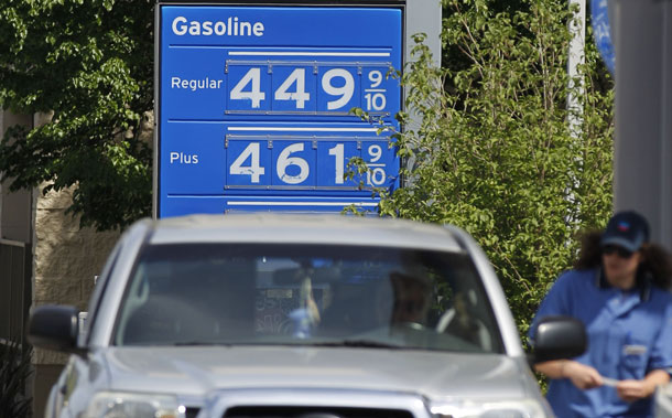Gas prices are displayed at a gas station in Portland, Oregon, earlier this month. Many Americans are altering their Memorial Day weekend plans to account for gas prices.
<br /> (AP/Rick Bowmer)